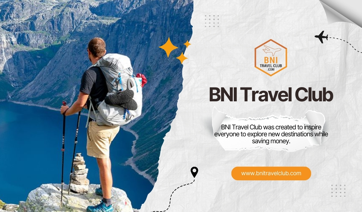 Traveller with Backpack and Hiking Poles Overlooking a Mountain Lake for BNI Travel Club Adventures